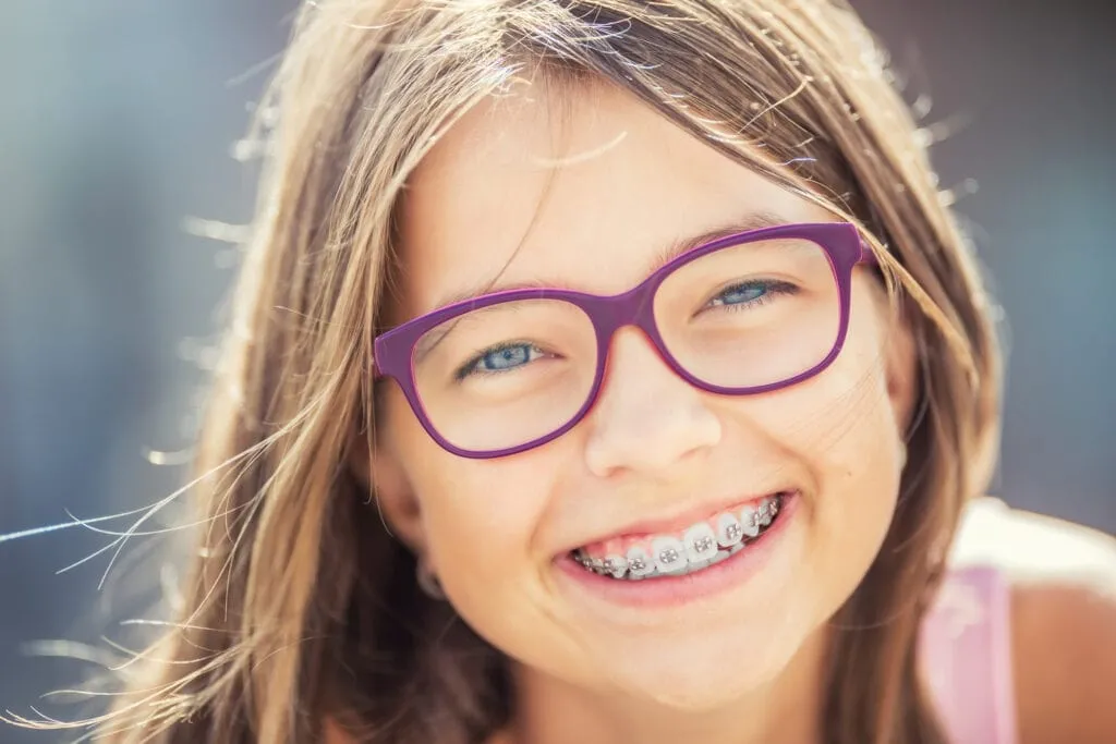 young-cute-caucasian-blond-girl-wearing-teeth-braces-glasses